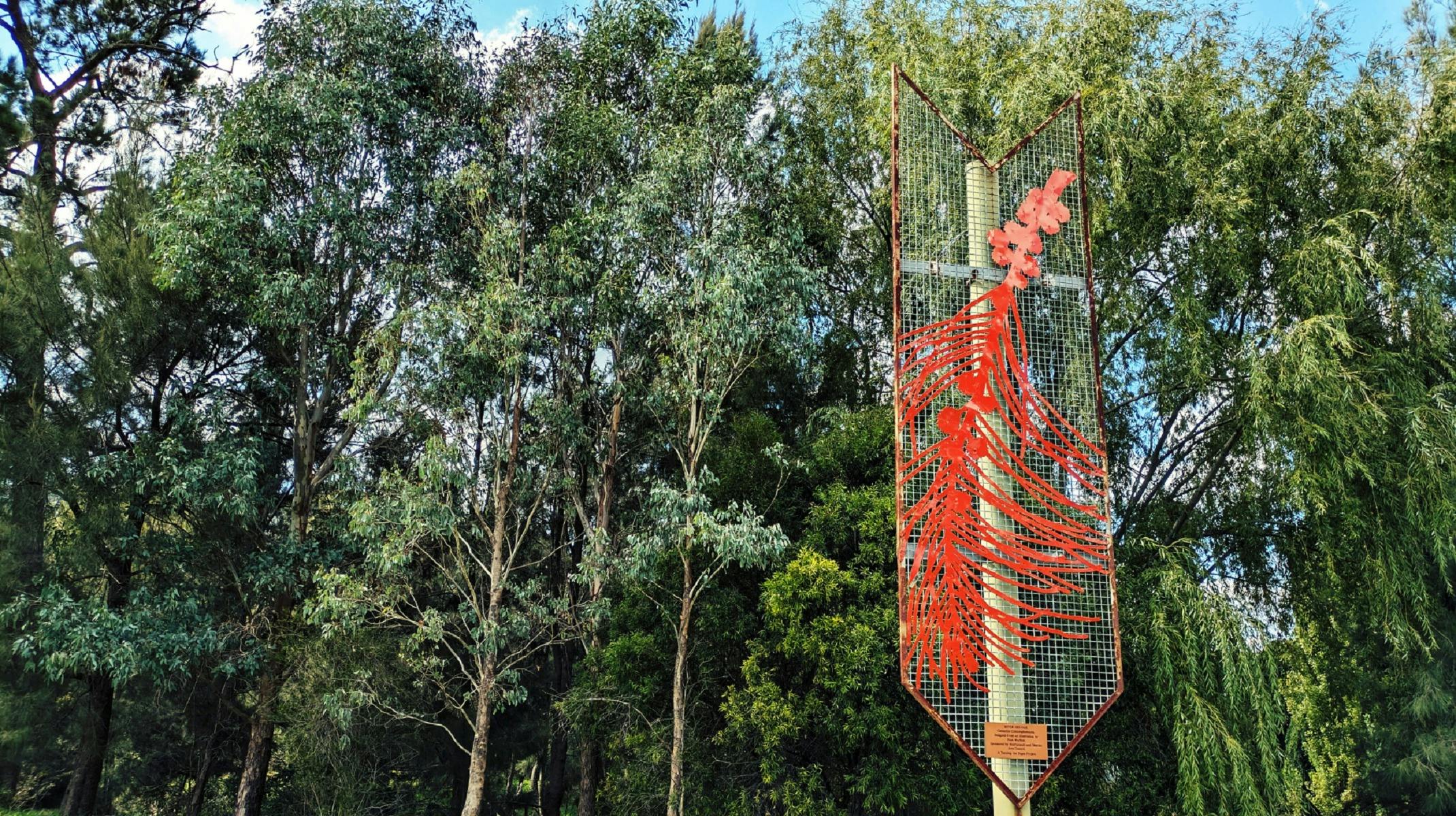 Turning the Pages Project Floral Metal Banner installation