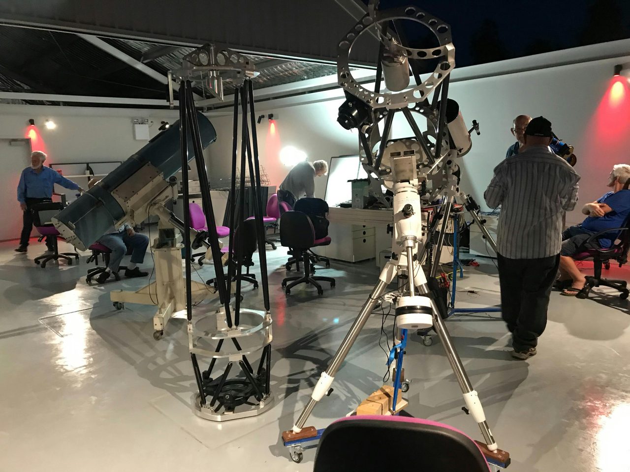 Telescopes set up for club viewing night in large roll-off-roof observatory