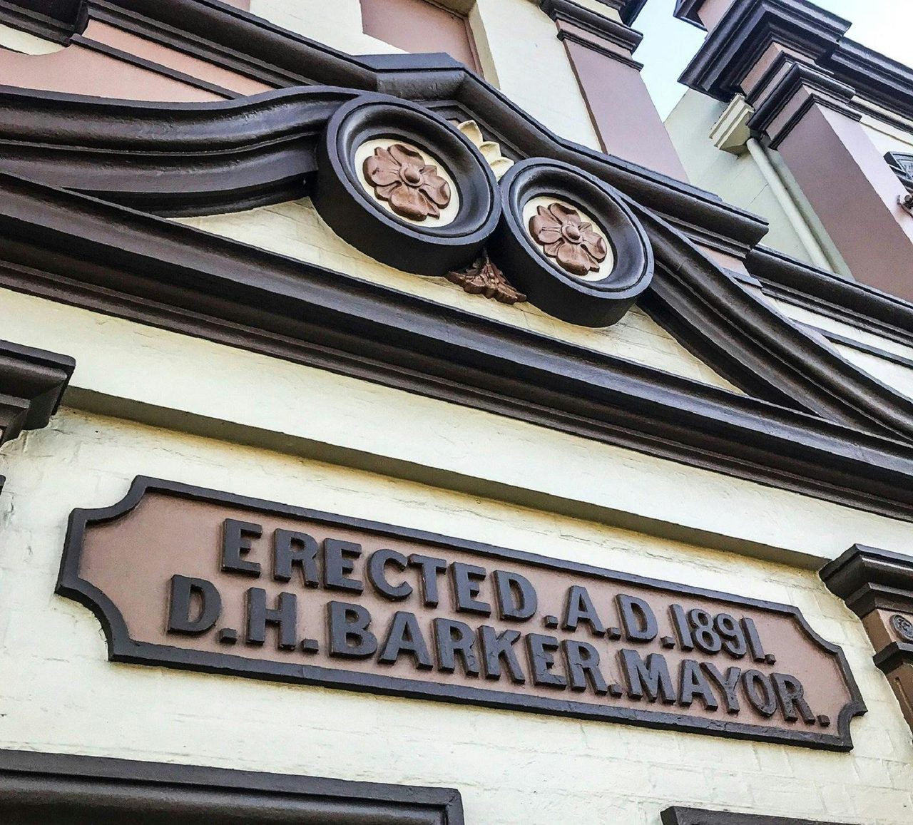 Building with the words "erected a.d. 1891 d.h. barker mayor" below