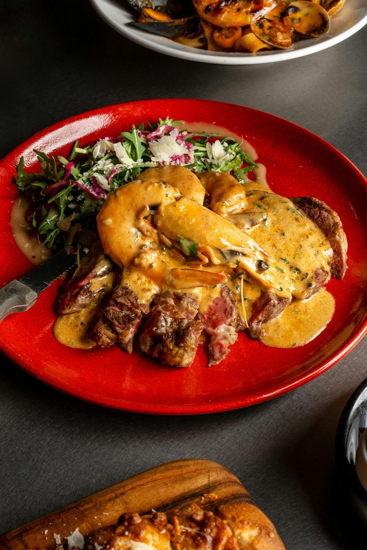 Scotch Fillet Surf and Turf with signature sauce