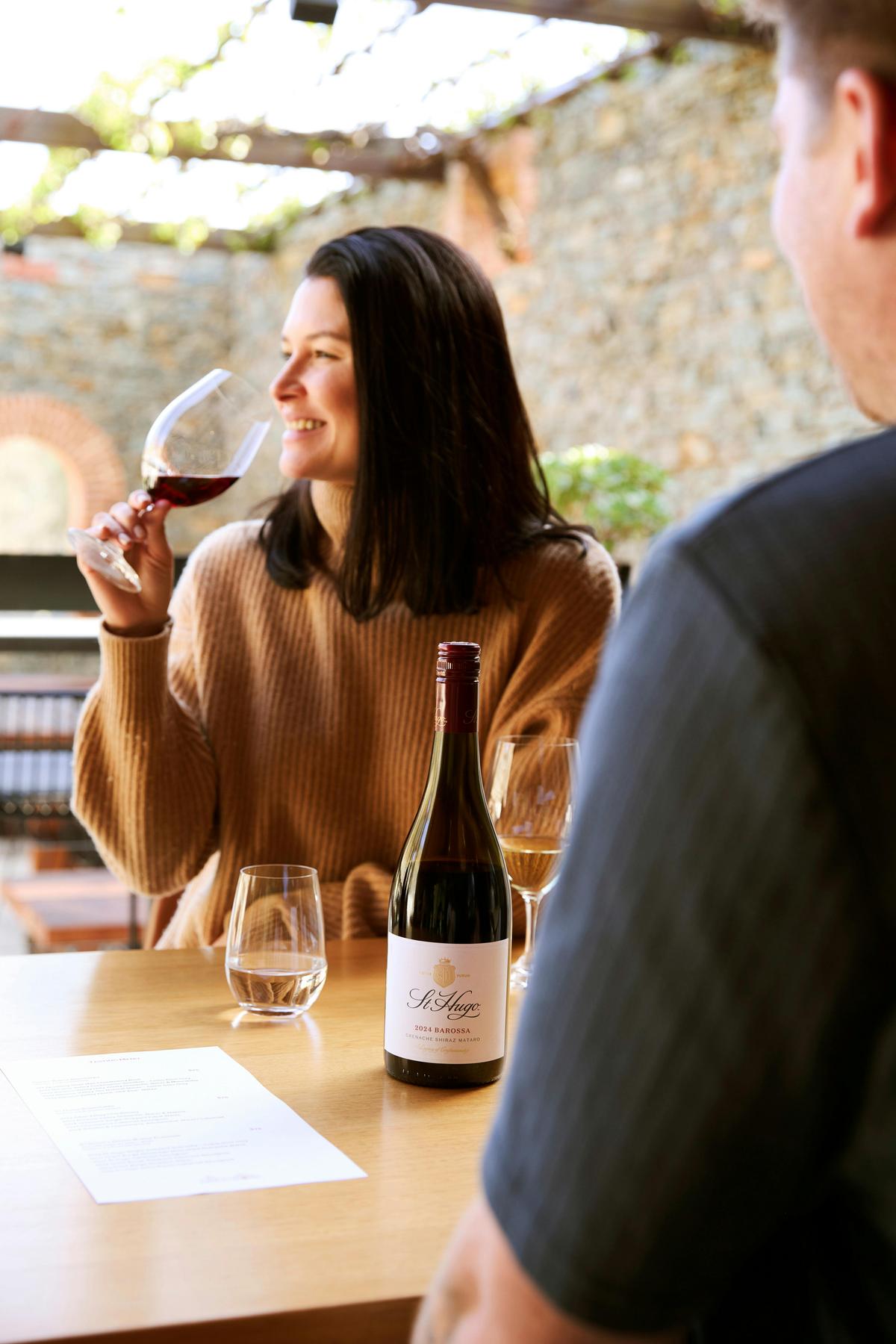 Female tasting wines