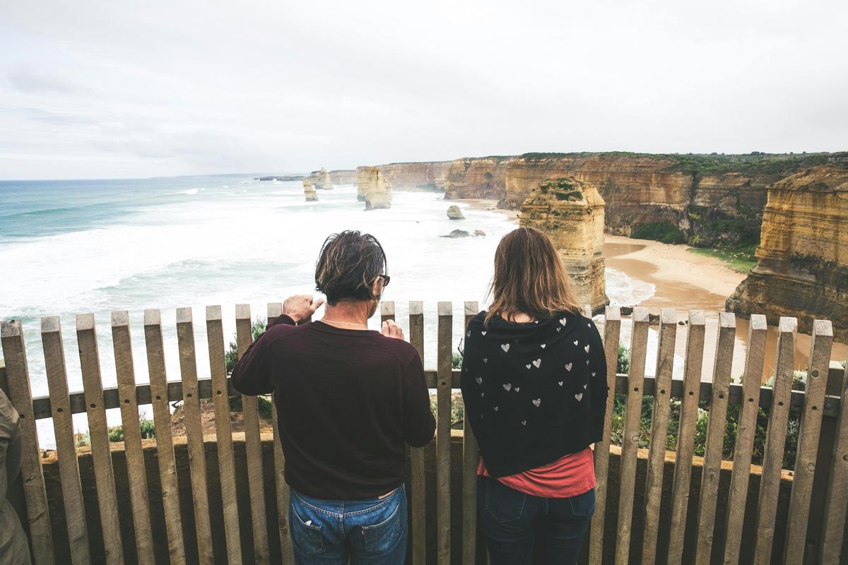 Couple looks out over the 12 apostles