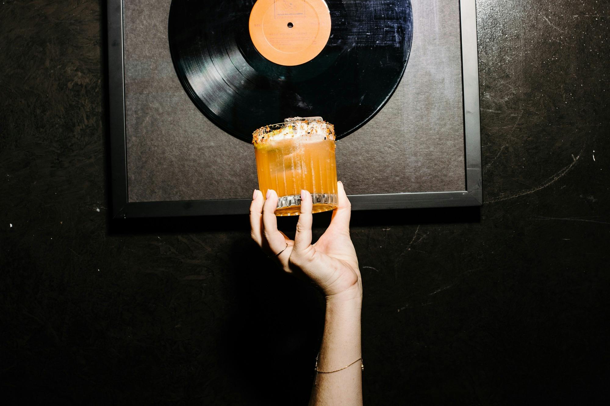 Hand holding up cocktail