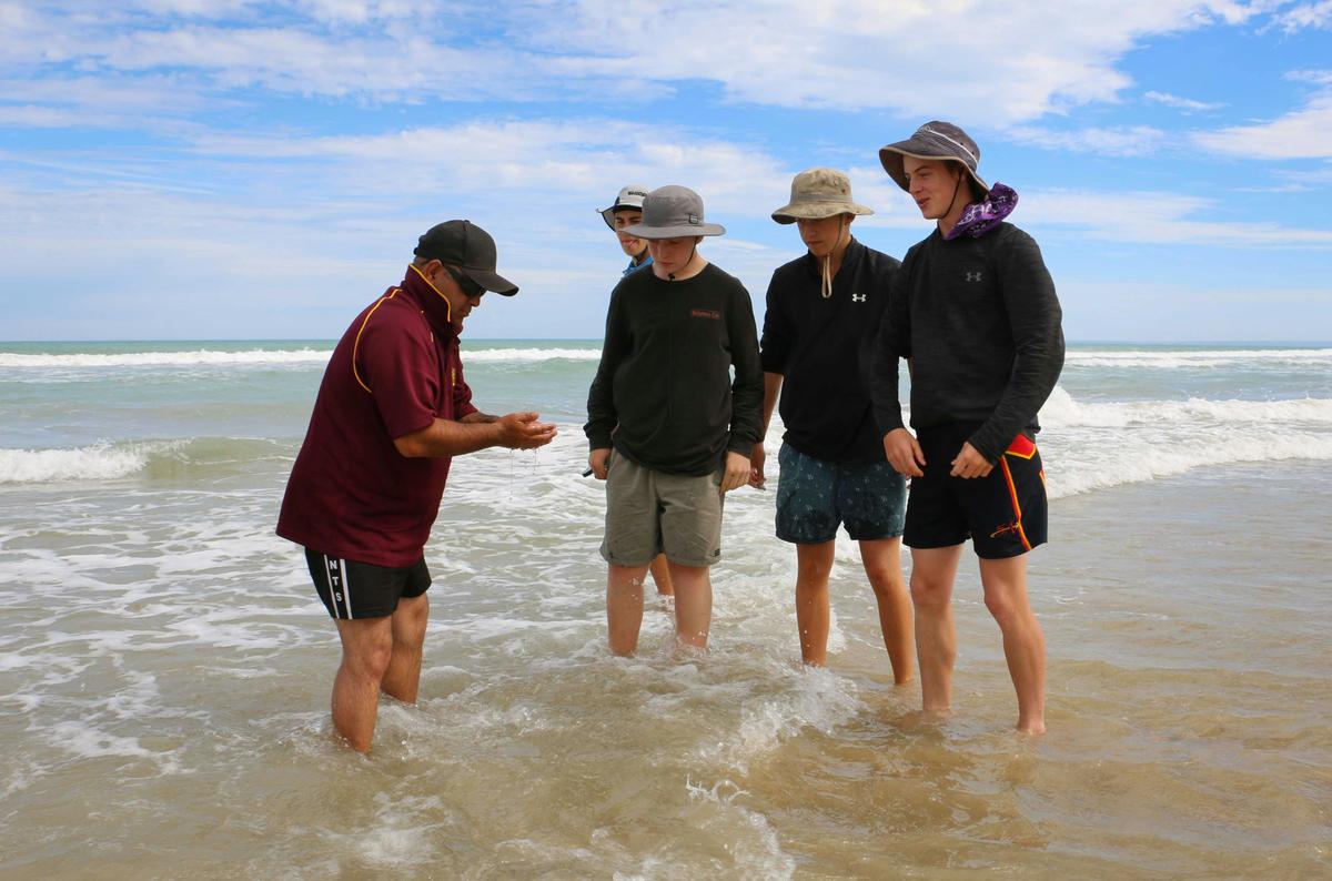 Joe one of our highly experienced tour operators showing how to collect food.