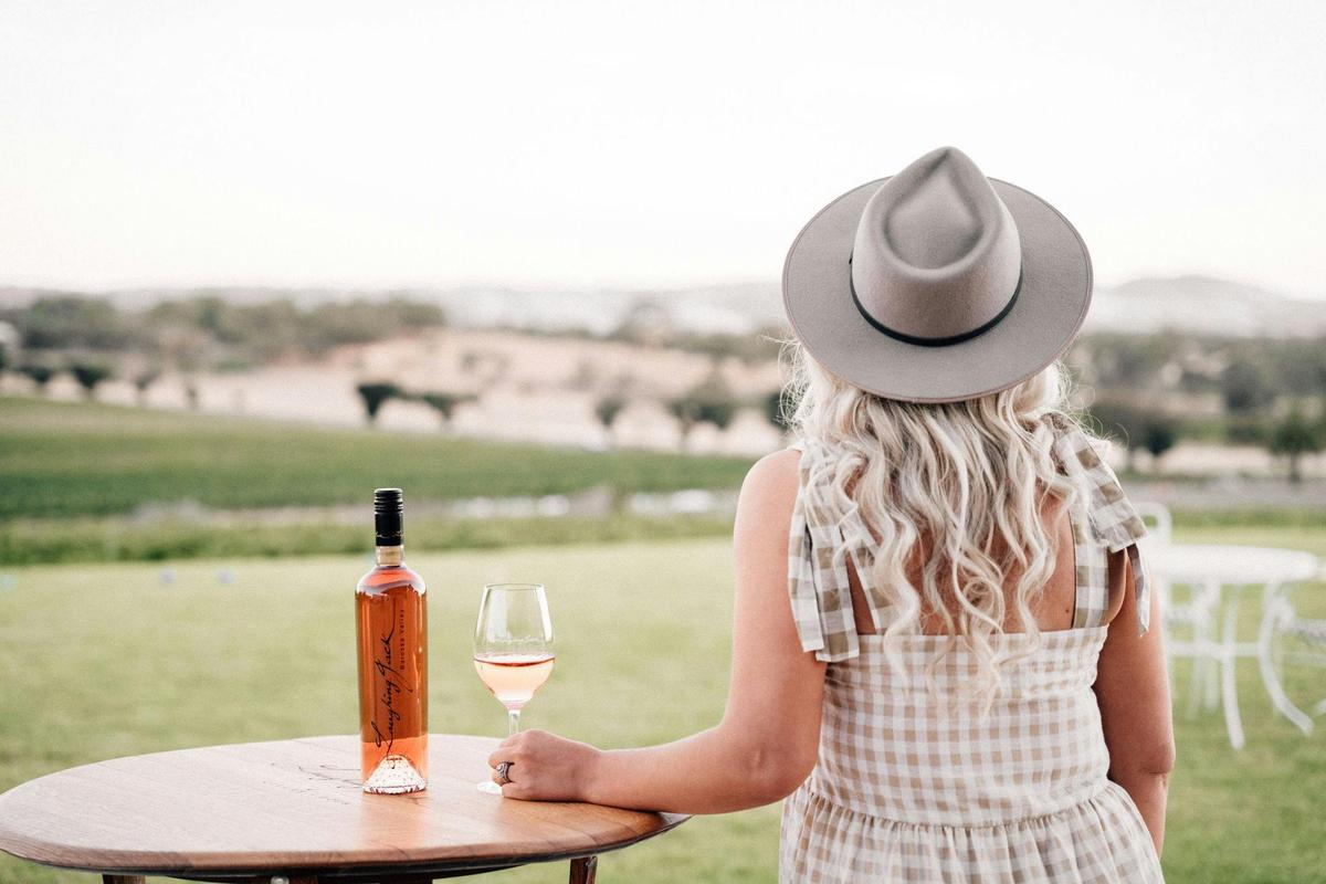 overlooking view with bottle of wine