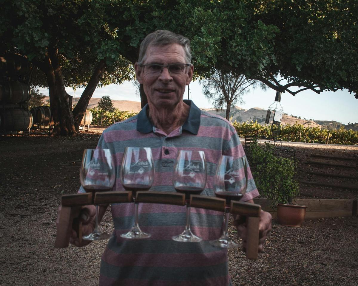 Ron Liebich holds fortified wine tasting flight