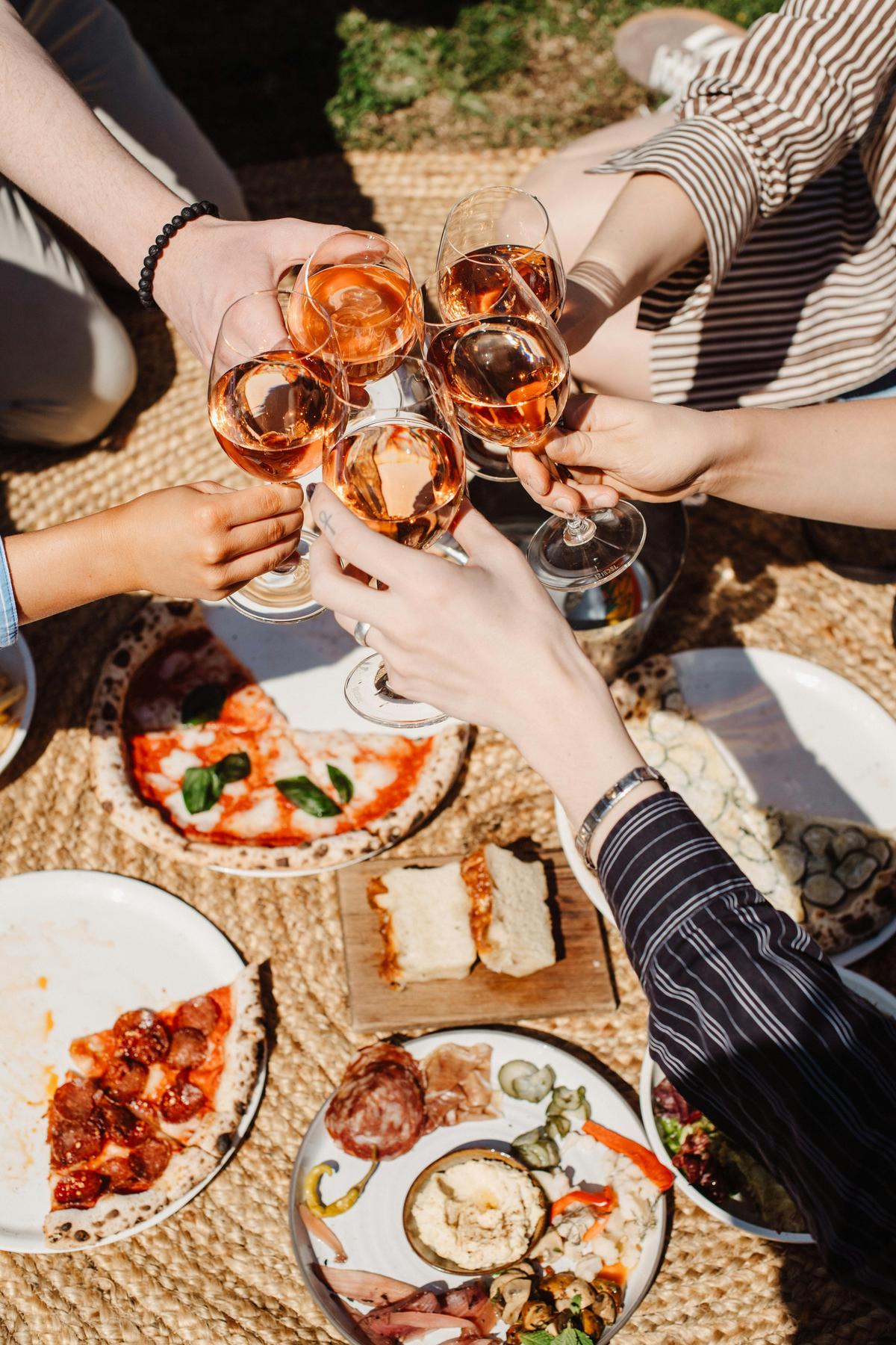 Pizzas and drinks on the lawn at Lot.100