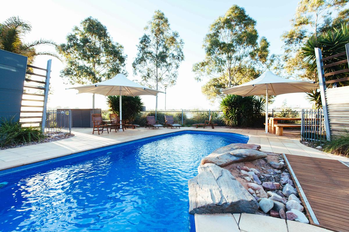 Majestic Oasis Apartments Pool and Barbeque Area for guests