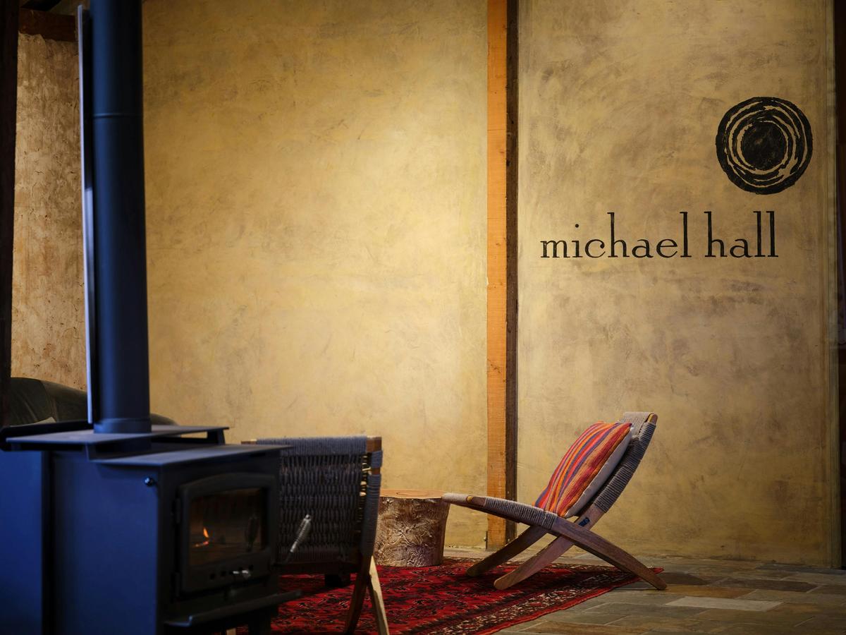 fireplace and armchair in tasting room