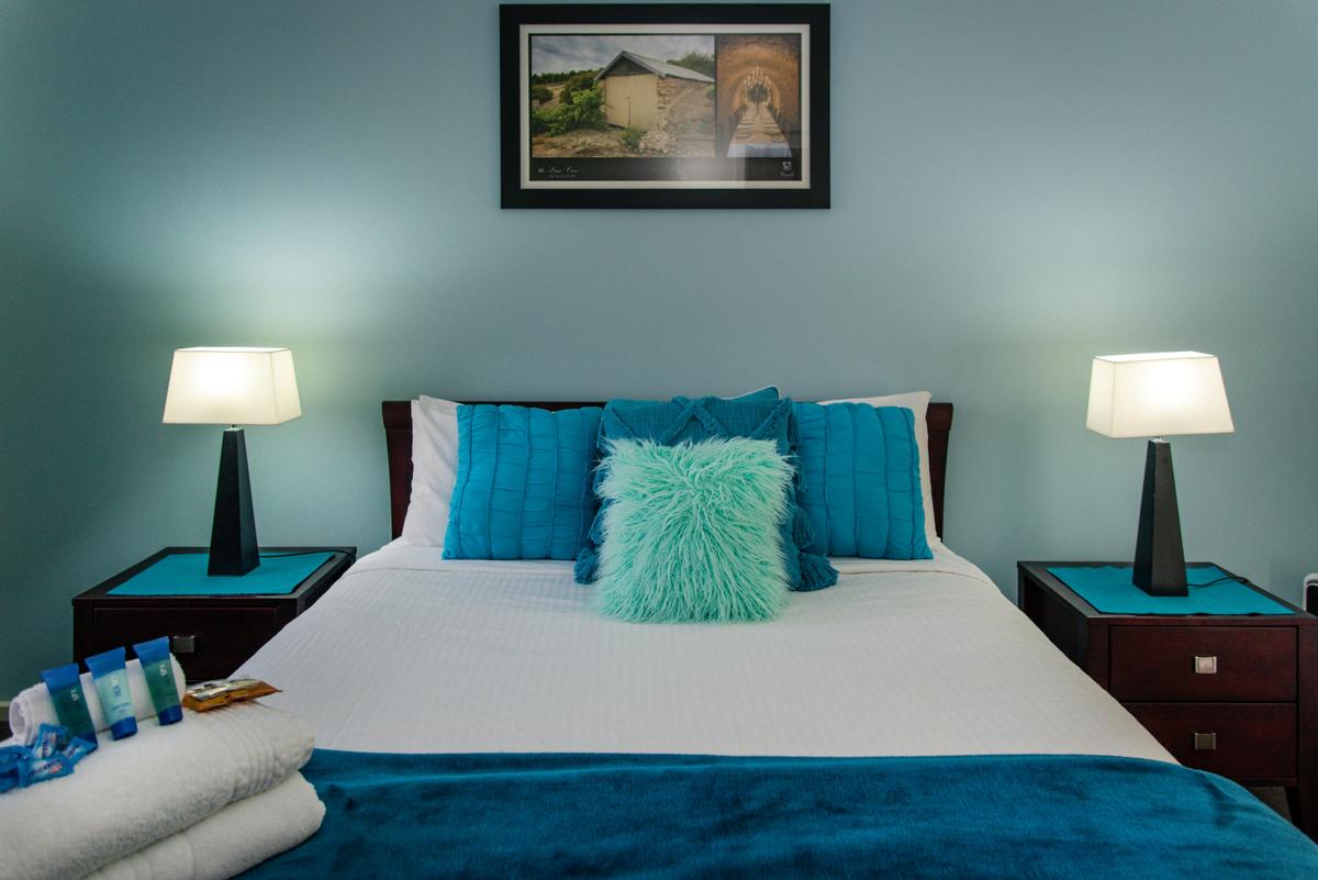 Main bedroom - large bed & access to bathroom