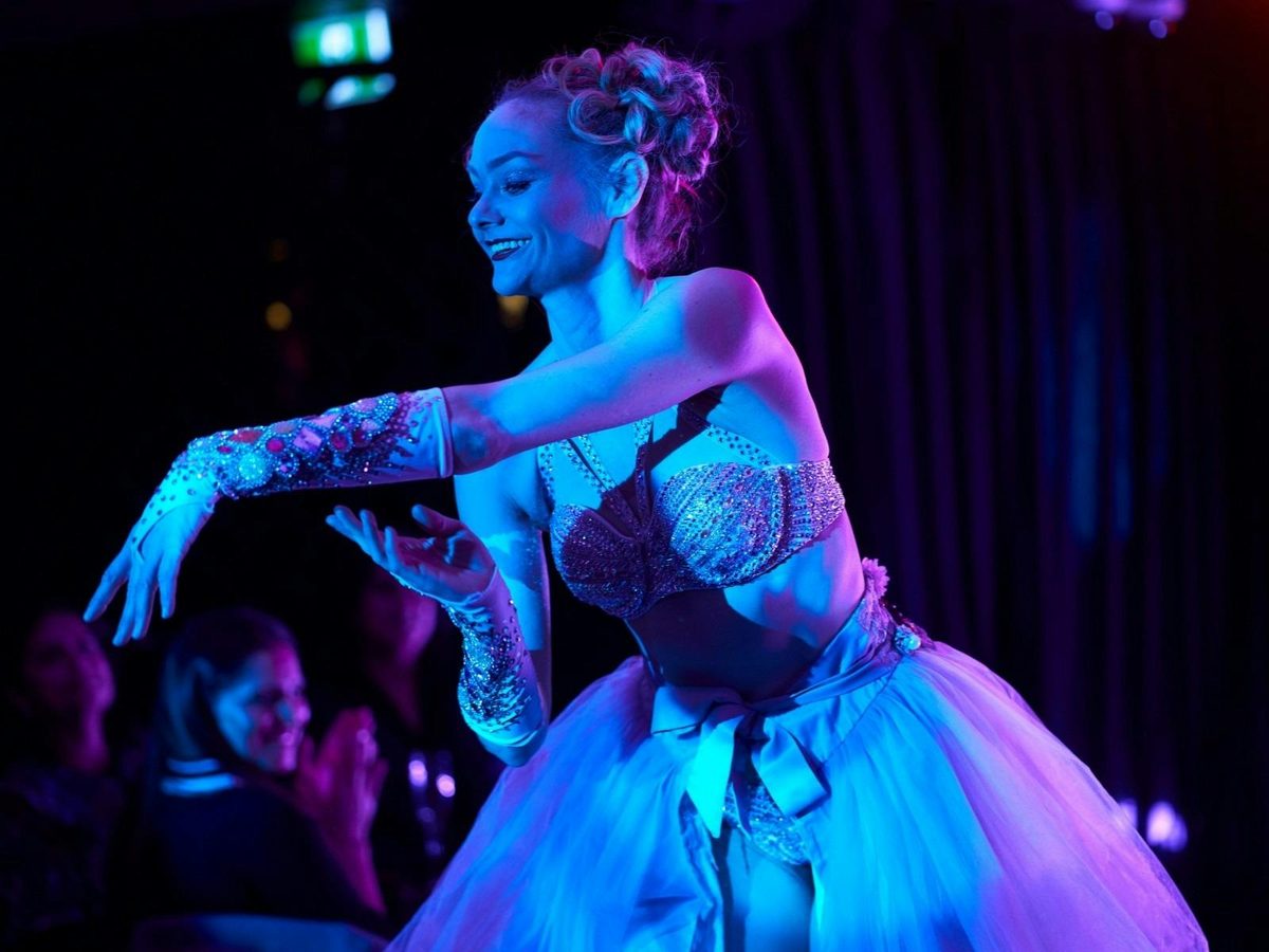 Elegant burlesque dancers perform at the Honeycomb Club