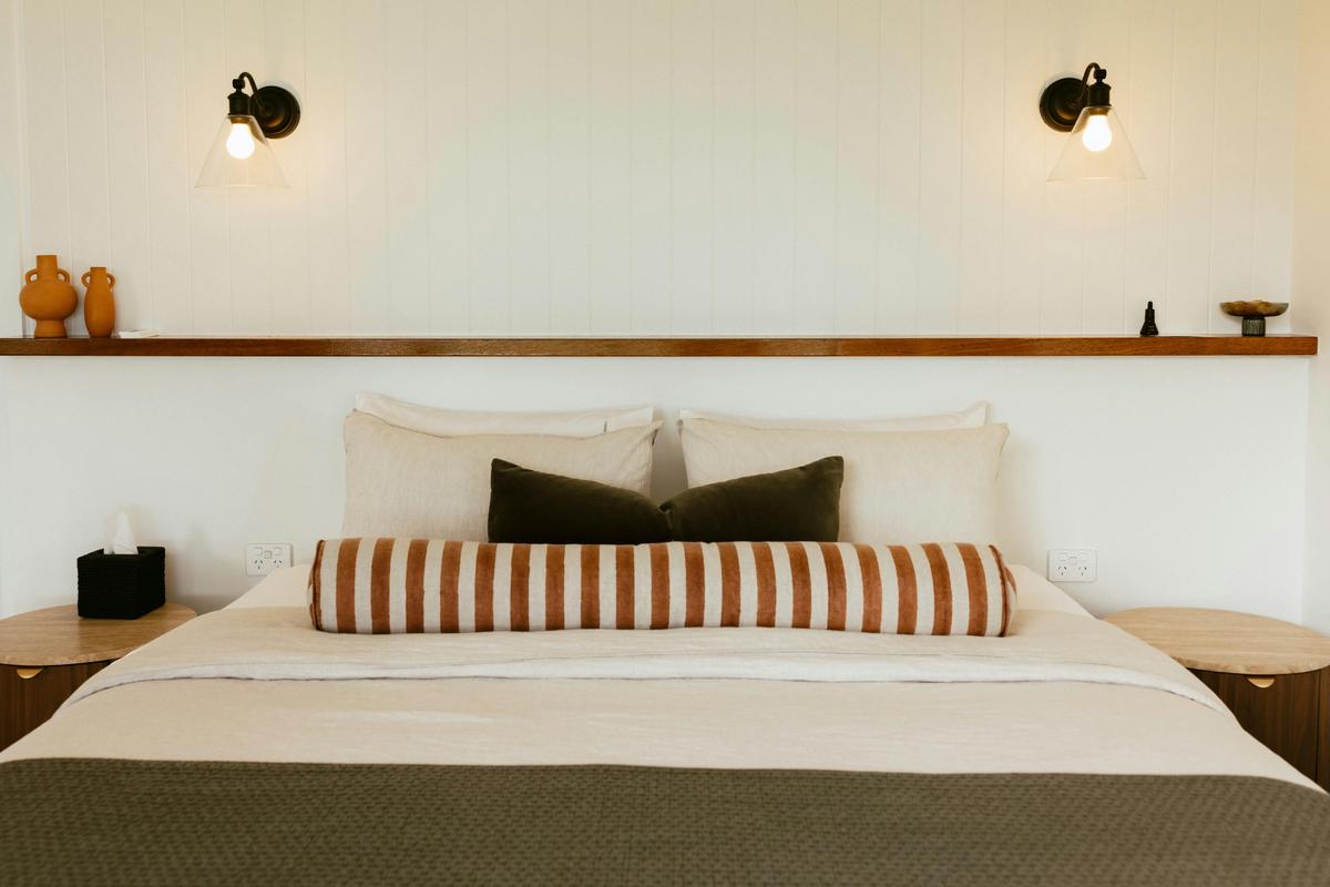Stylish Master Bedroom with walk-in robe behind, the same stunning views to the coast