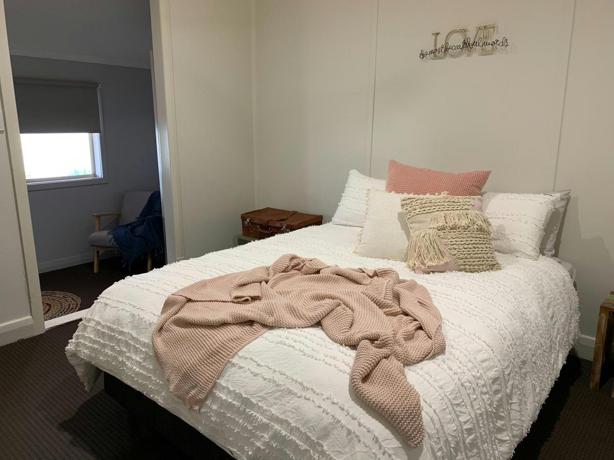 Bedroom 2 furnished with queen bed