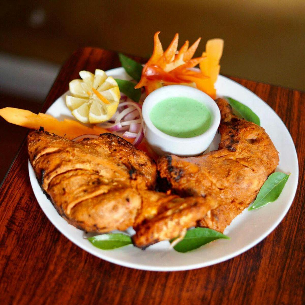 Tandoori Chicken. The nice smokey flavour is dded through our traditional Indian wood burning oven.