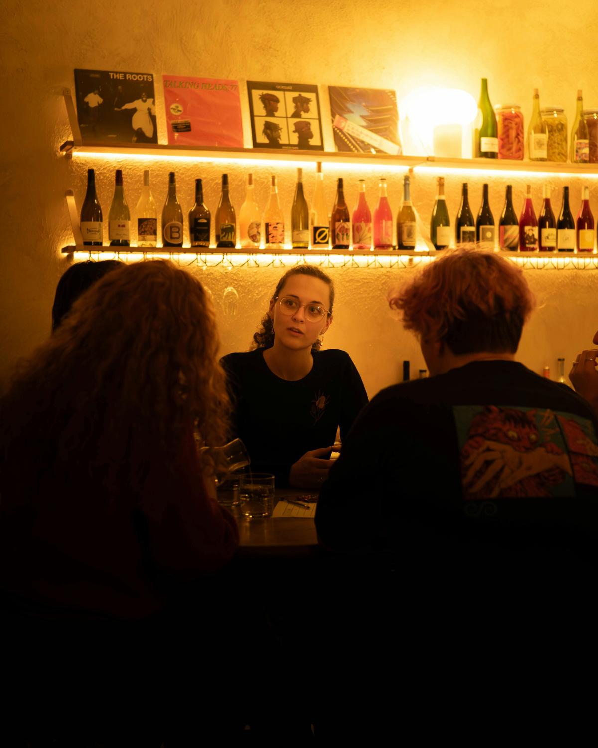 people sitting at the bar