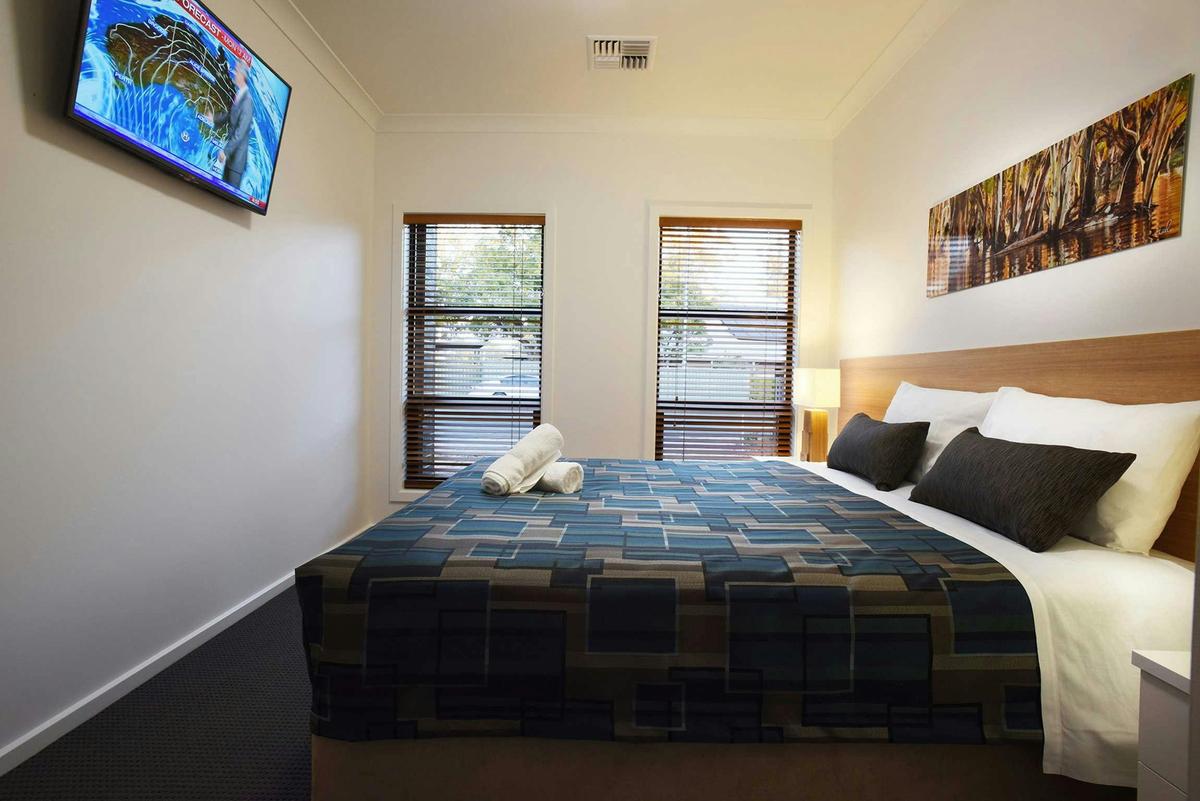 King bedroom (can split into singles) with TV, walk in robe and ensuite