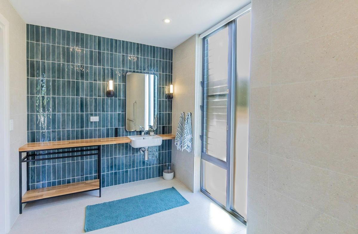Bathroom with sink and mirror