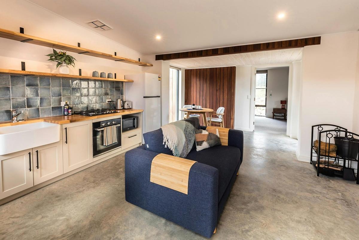 Open plan living area with kitchen, lounge and dining
