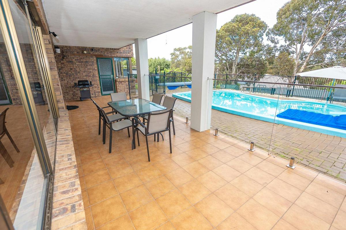 patio overlooking the pool and lovely view