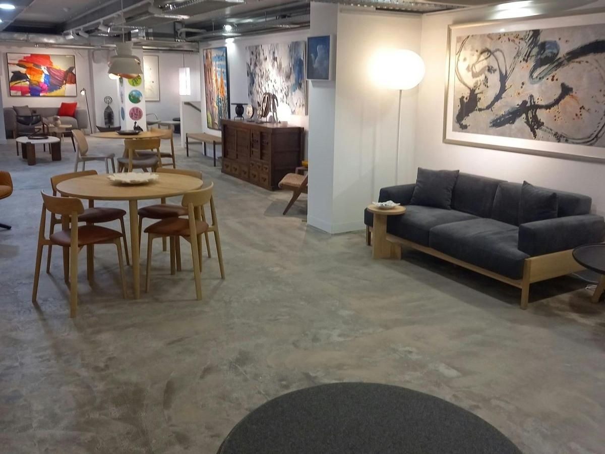 Image of furniture and artworks in the side gallery