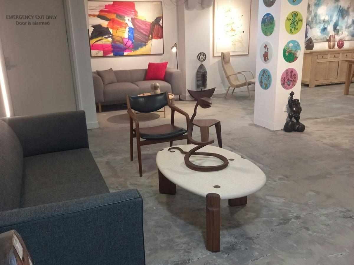 Image of furniture and artworks in back left gallery