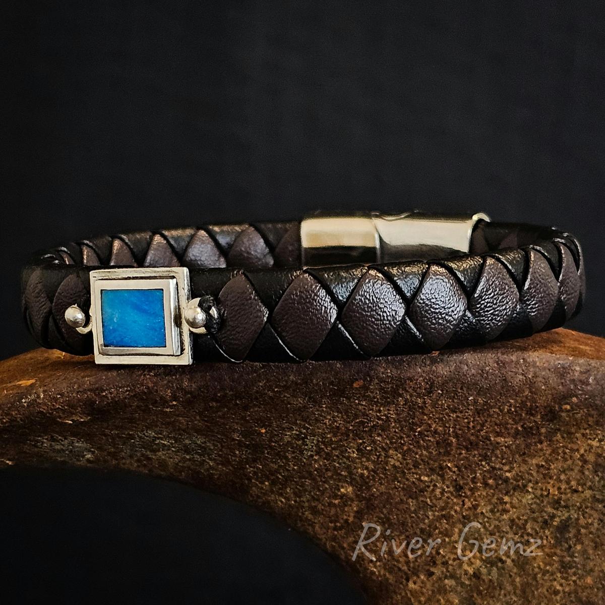 Lightning Ridge Crystal opal inlayed in sterling silver and attached to a leather bracelet.