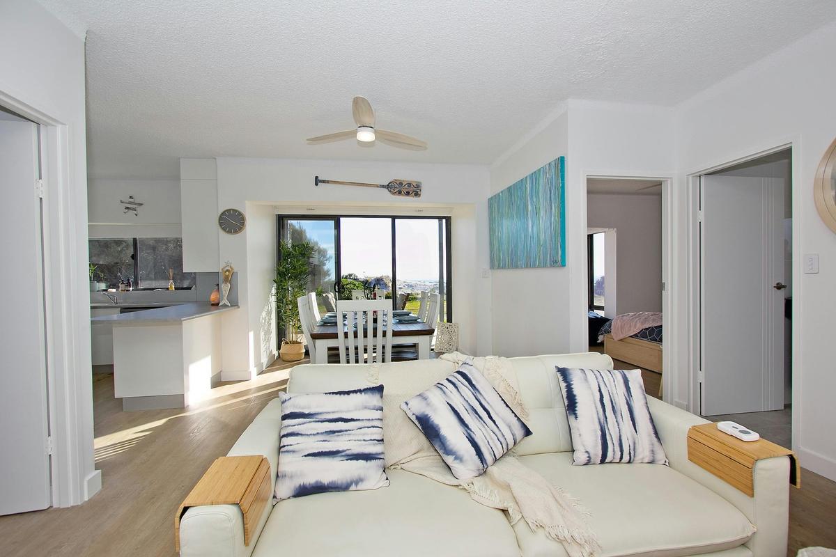 Lounge, dining and kitchen are all open plan with views of the ocean