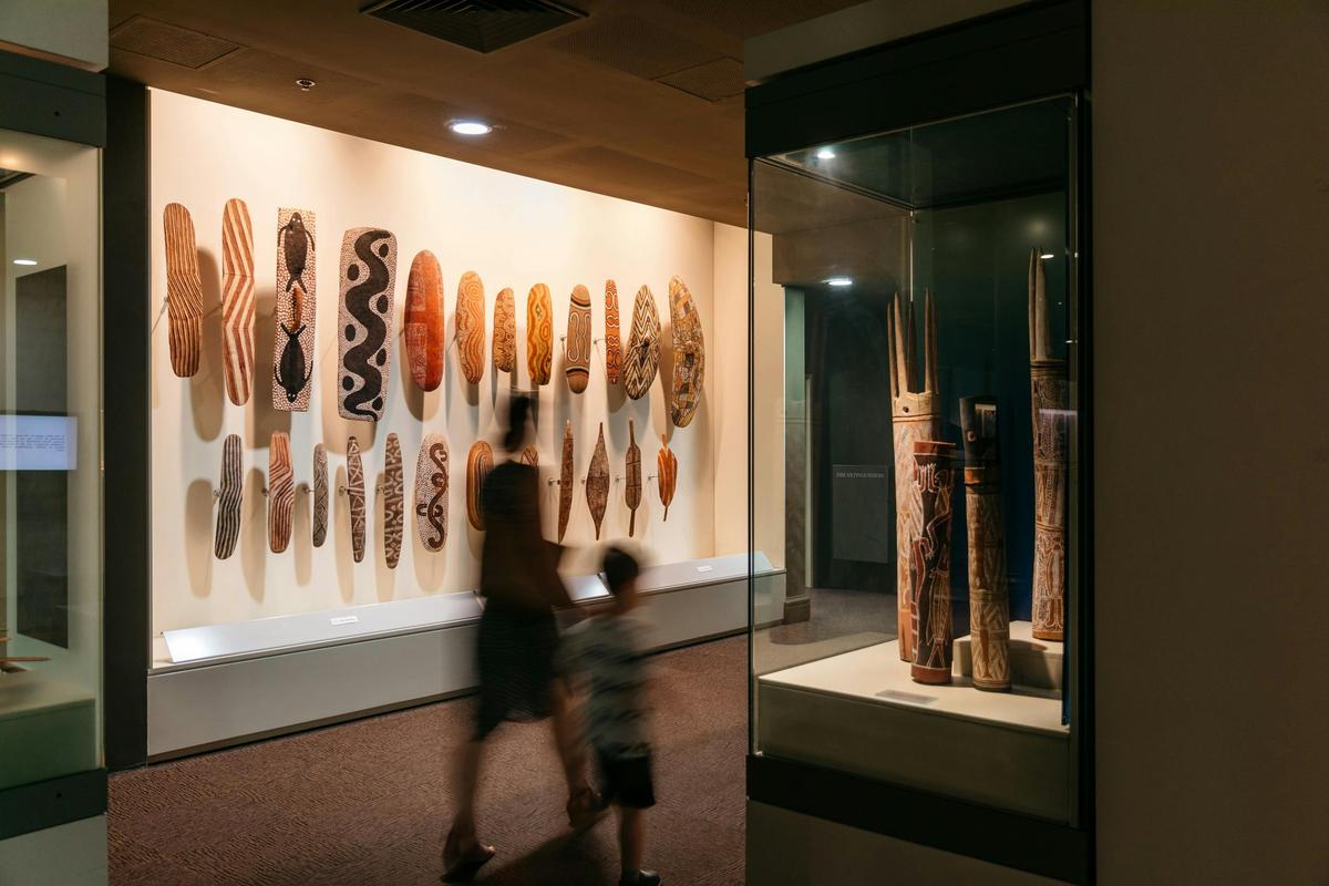 Parent and child walking through Australian Aboriginal Cultures Gallery