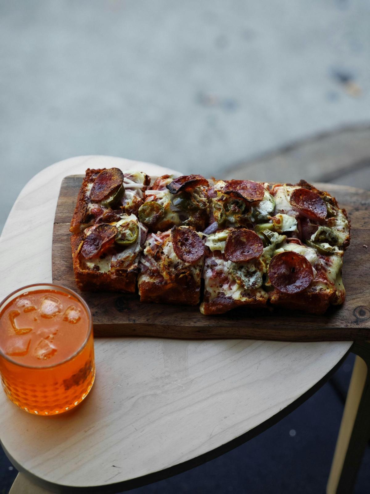 Deep dish house baked focaccia with one of our signature drinks - the salty plum gin