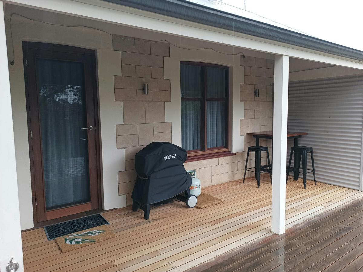 Strathalbyn Cottage Central's panormaice deck overlooks a private nature reserve to the Angas River