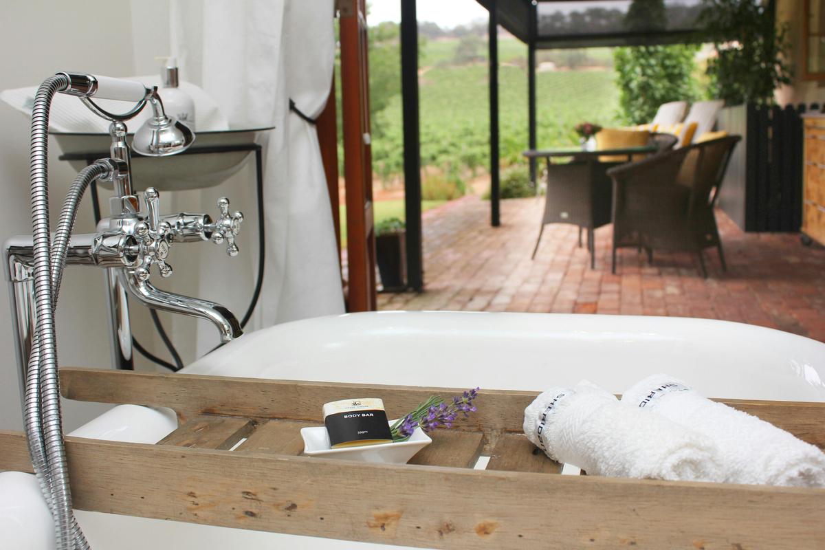 Luxury bathroom with vineyard views & Bose Wave system to play some soothing music.
