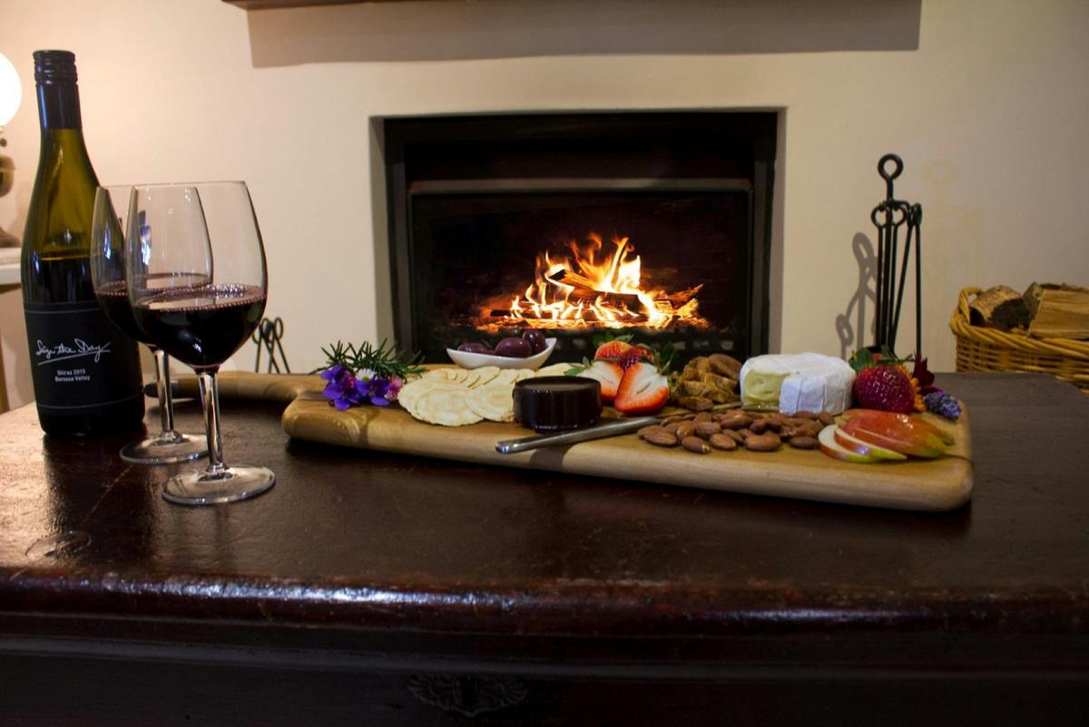 Enjoy a grazing platter and wine in front of the fireplace
