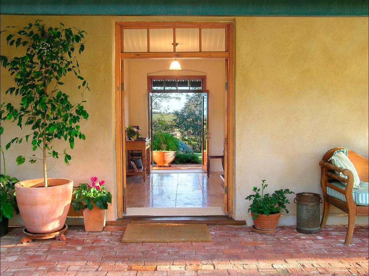 Cottage front entrance with views through to beautiful gardens &  Hentley Farm restaurant.