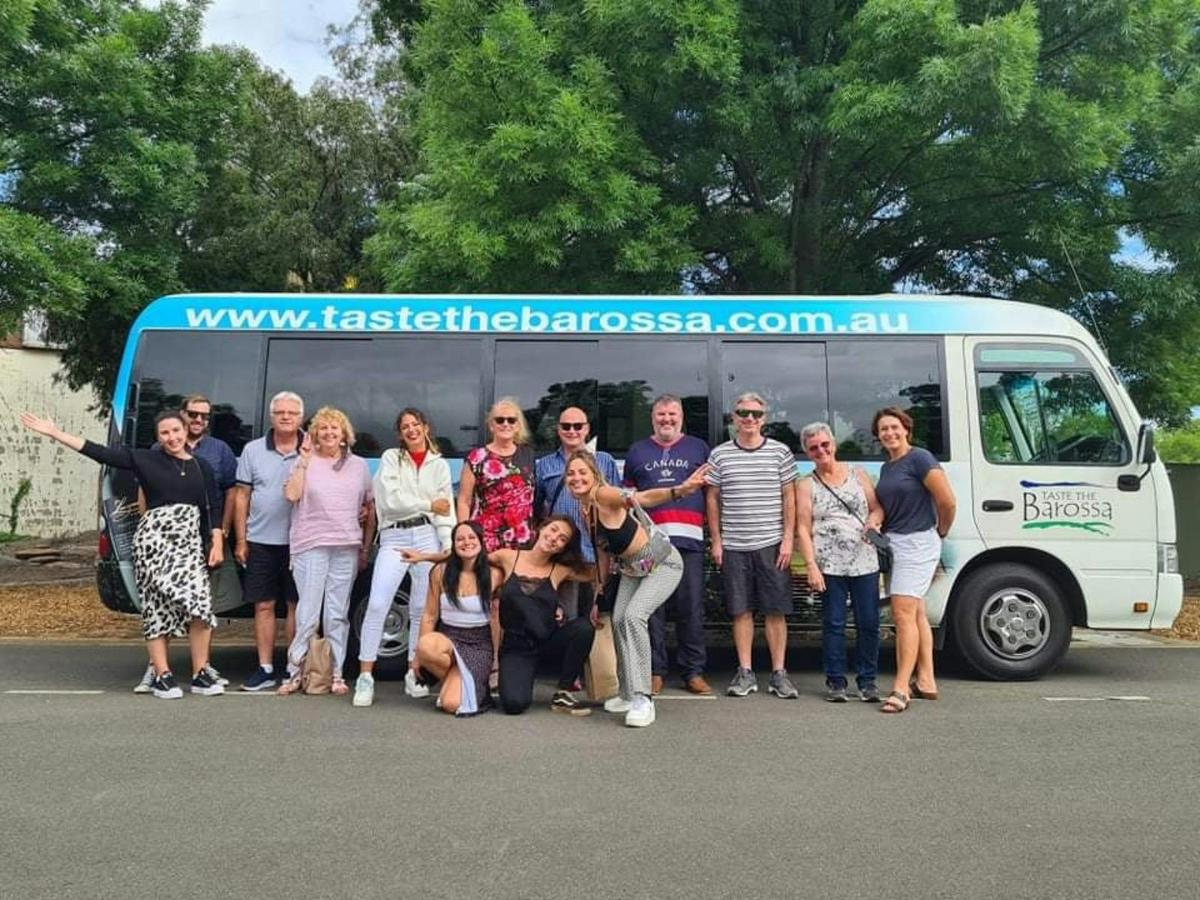 Group in front of taste the barossa bus