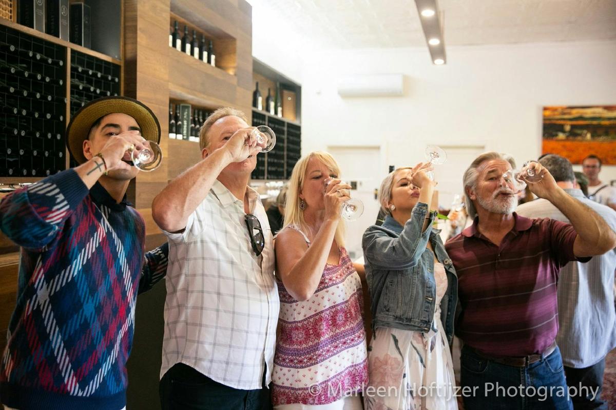 Group enjoying a glass of wine