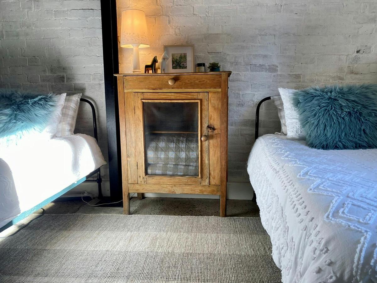 Cosy second room with twin single beds.
