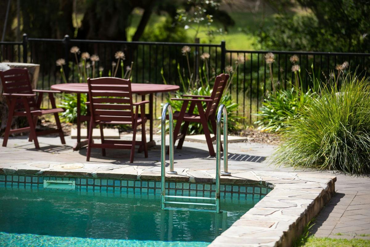 The swimming pool provides the perfect location to cool off on a hot day