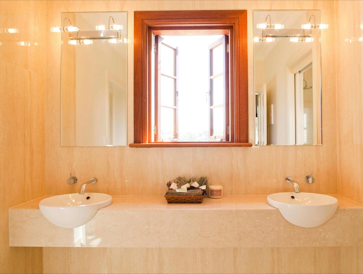 Twin hand basins set in luxurious marble.
