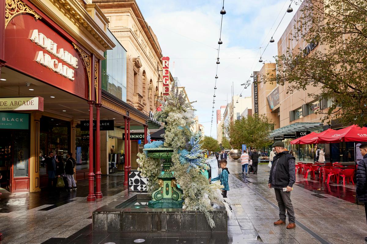 The Rundle Mall Fountain adorned with flowers for Frozen the Musical