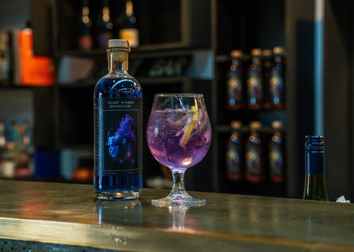 glass of gin next to a bottle