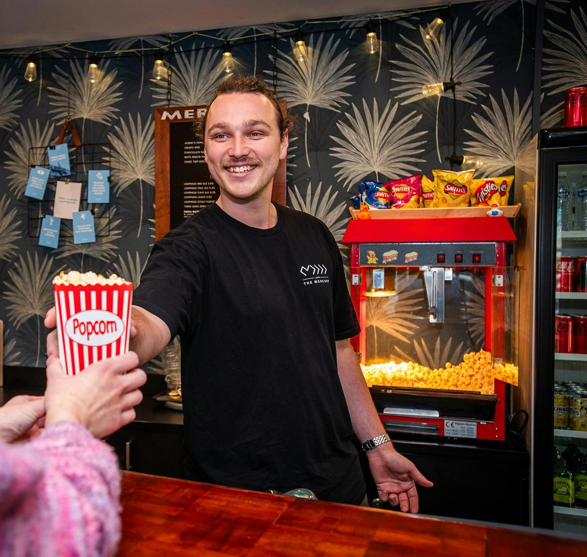 Bar Staff Serving Popcorn
