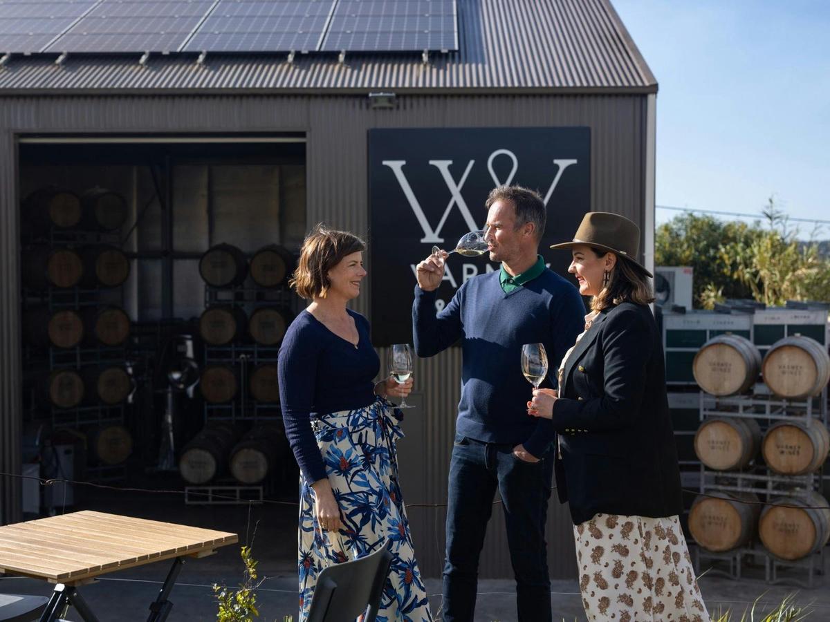 Guests enjoying a glass of wines on the lawns near the winery at Varney Wines.