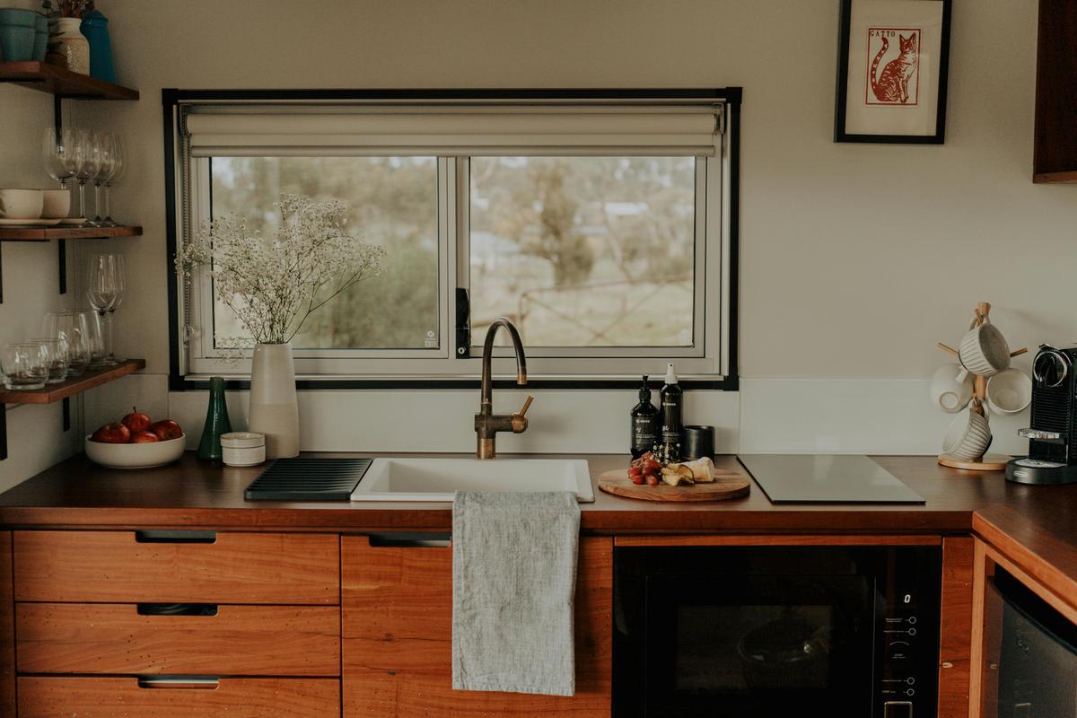 Kitchen with timber benches and luxury amenities