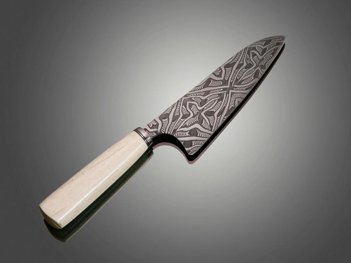 Mosaic Damascus Santoku kitchen knife with whale bone handle.