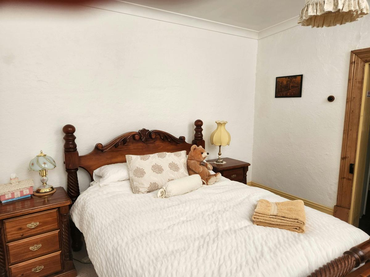 Comfortable double bed with goose-down quilt.