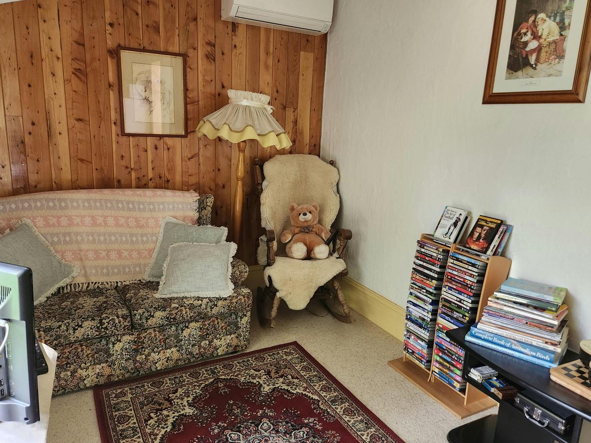 Private loungeroom with a selection of CD's, reading materials and games.