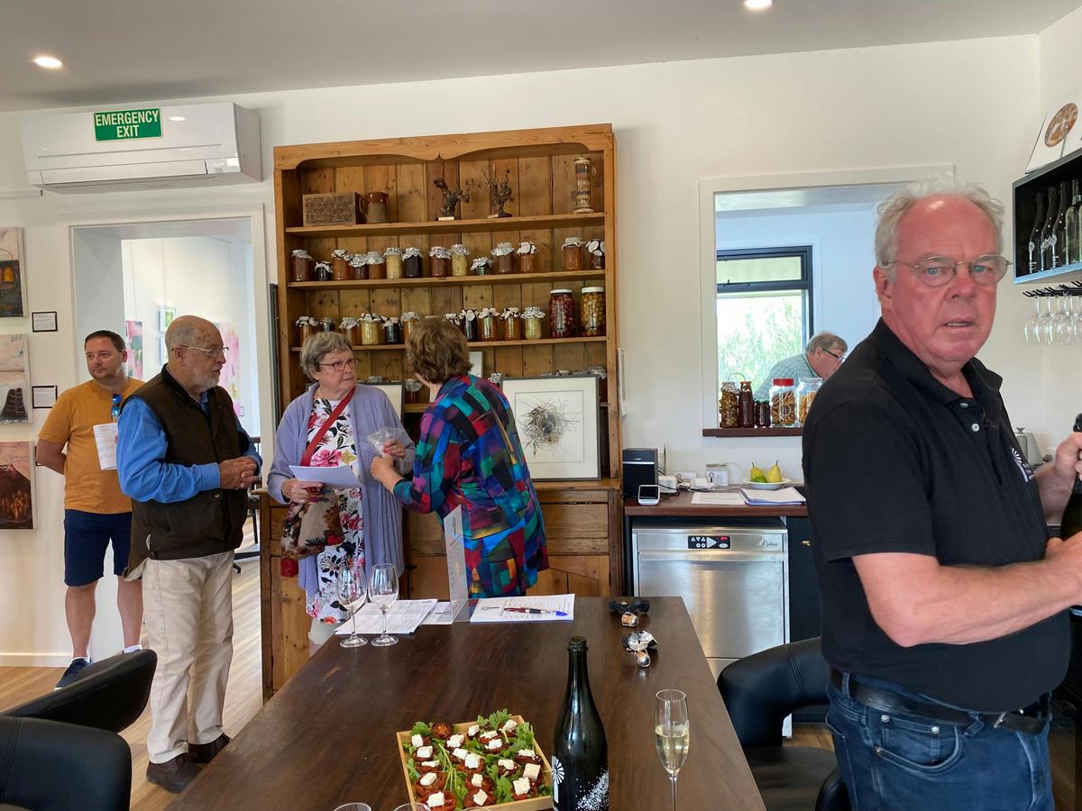 Happy cellar door customers with host Barry