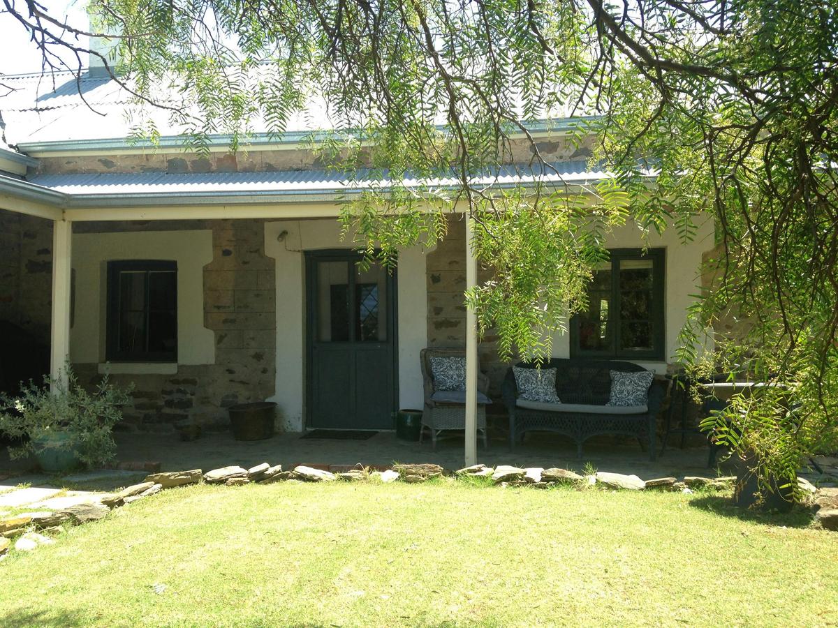 Front verandah and entrance of Yelki by the Sea, a heritage-listed stone cottage in Encounter Bay