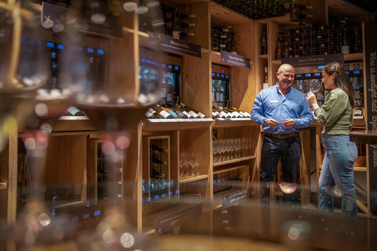 sommelier showing available wines