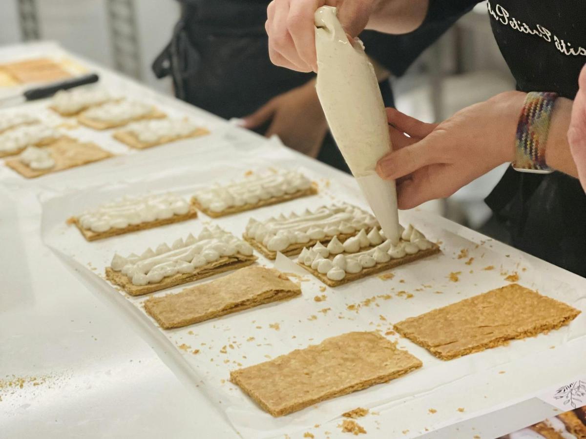 Piping the diplomate cream on the puff pastry